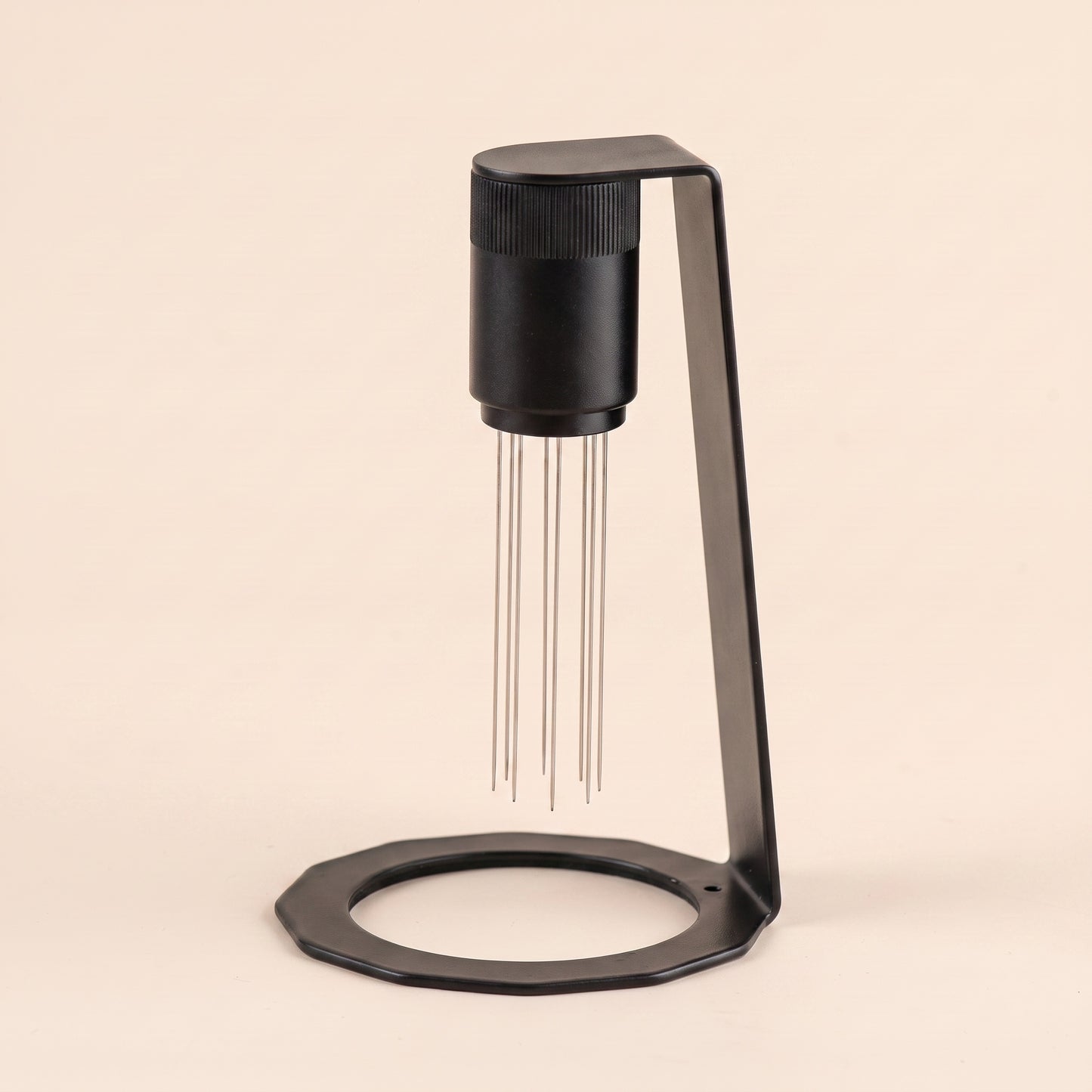 WDT tool parked on its magnetic stand, side profile, matte black metal base