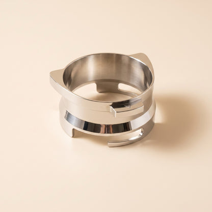 Dosing funnel top tab pressing a grinder's trigger during hands-free dosing