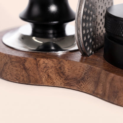 Close-up of the walnut grain and oiled finish on the tamping station