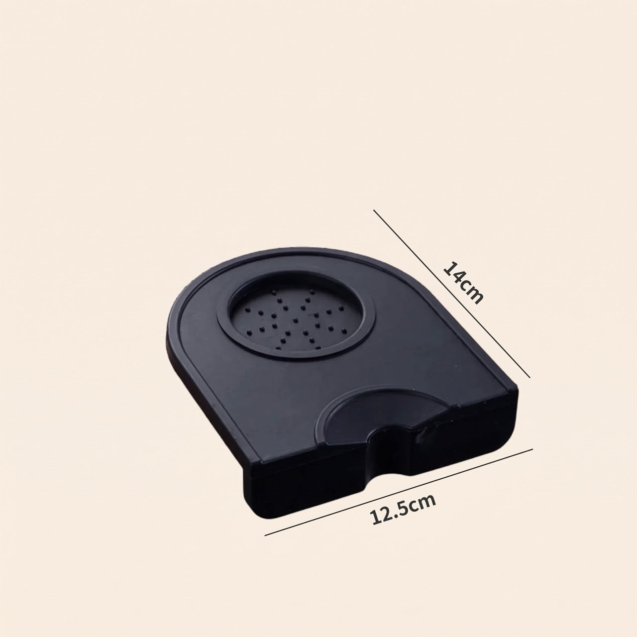 Silicone corner tamping mat on a home espresso bench beside a portafilter