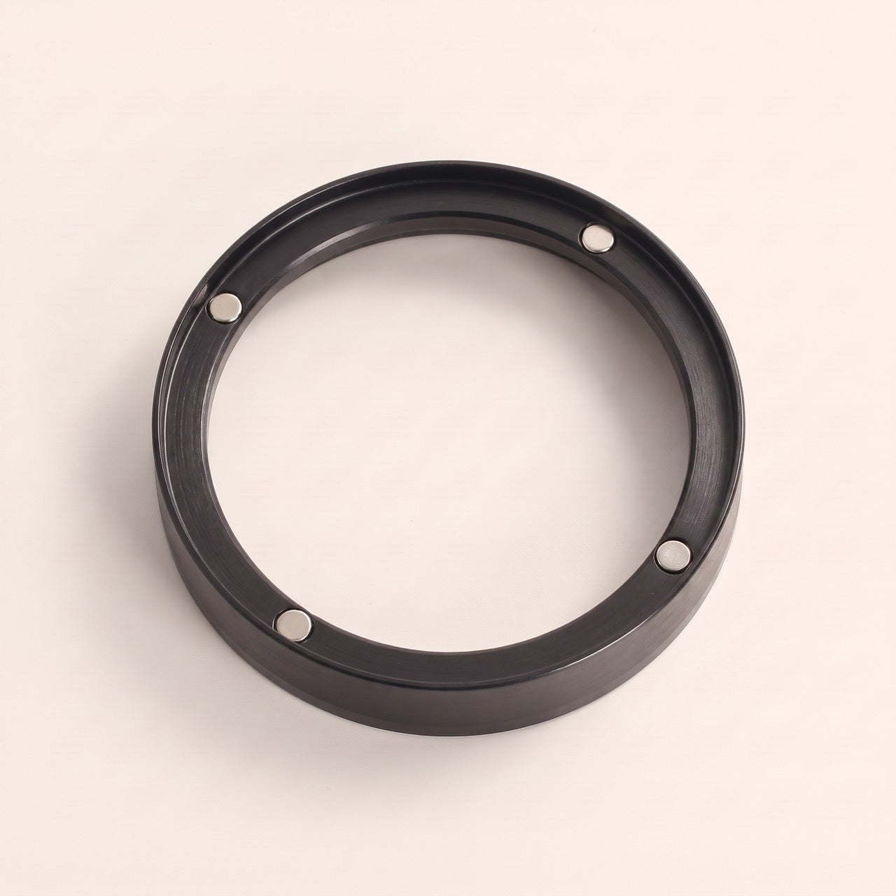 Close-up of the embedded magnets on the outside rim of the dosing funnel
