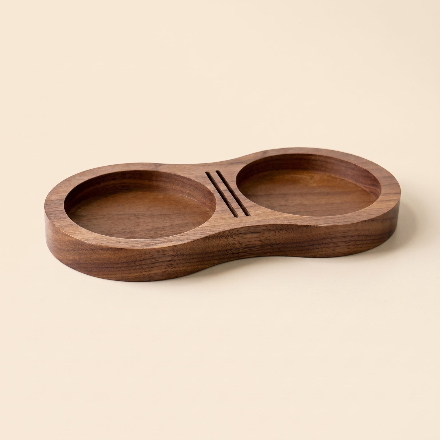 Walnut tamping station with a puck screen slotted into the centre divider