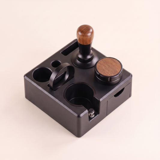 Tamping station with adjustable portafilter cradle, front view on a neutral background