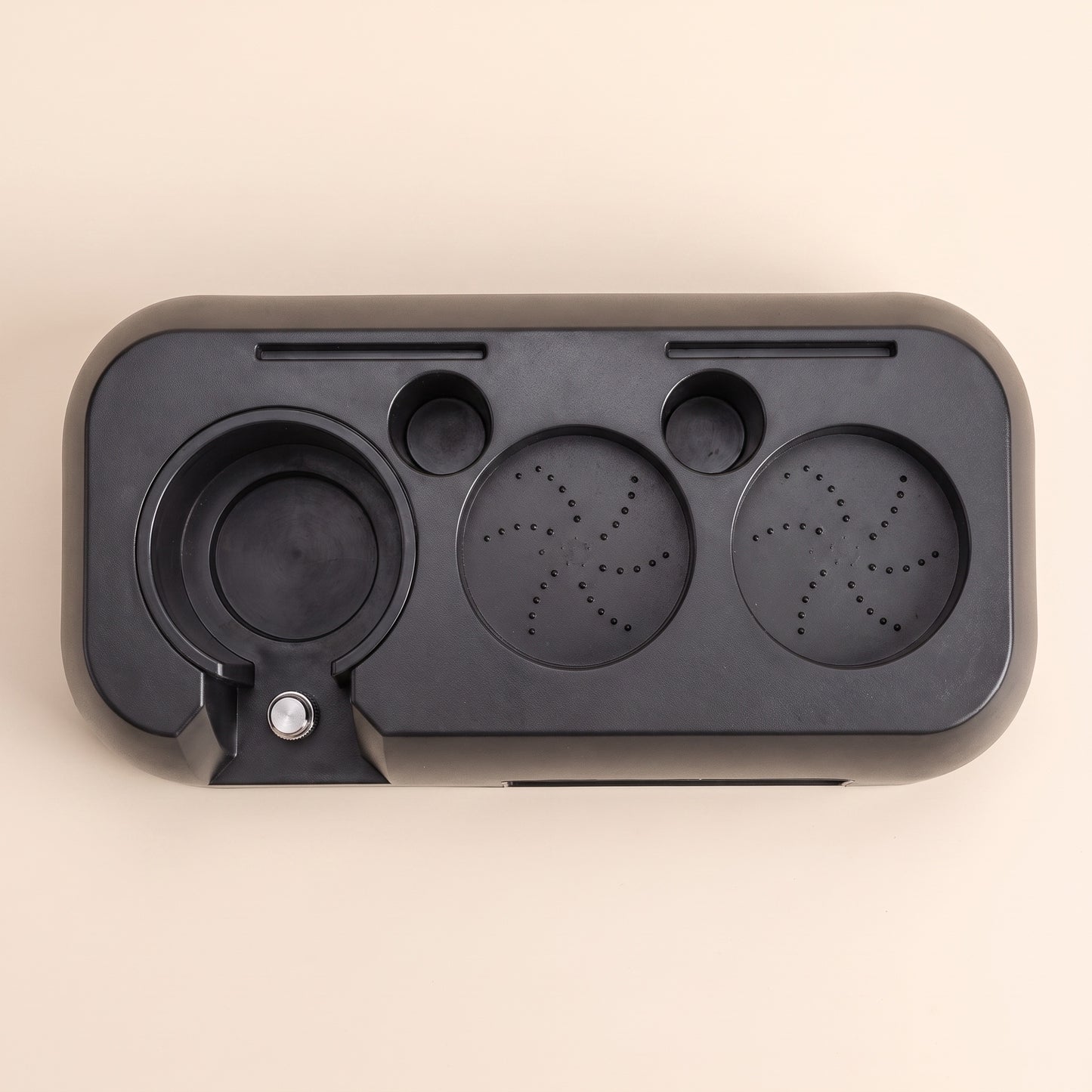 Close-up of the silicone feet on the base of the ABS tamping station