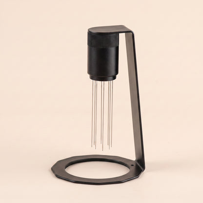 WDT tool parked on its magnetic stand, side profile, matte black metal base