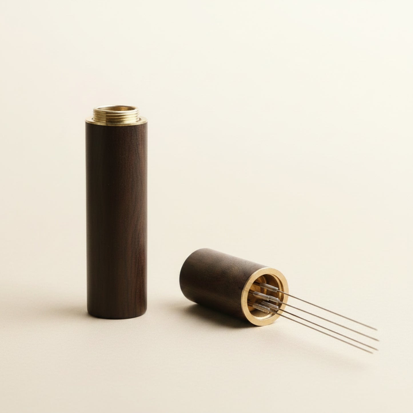 WDT tool with dark wood handle, front view on cream background, five fine needles for espresso distribution
